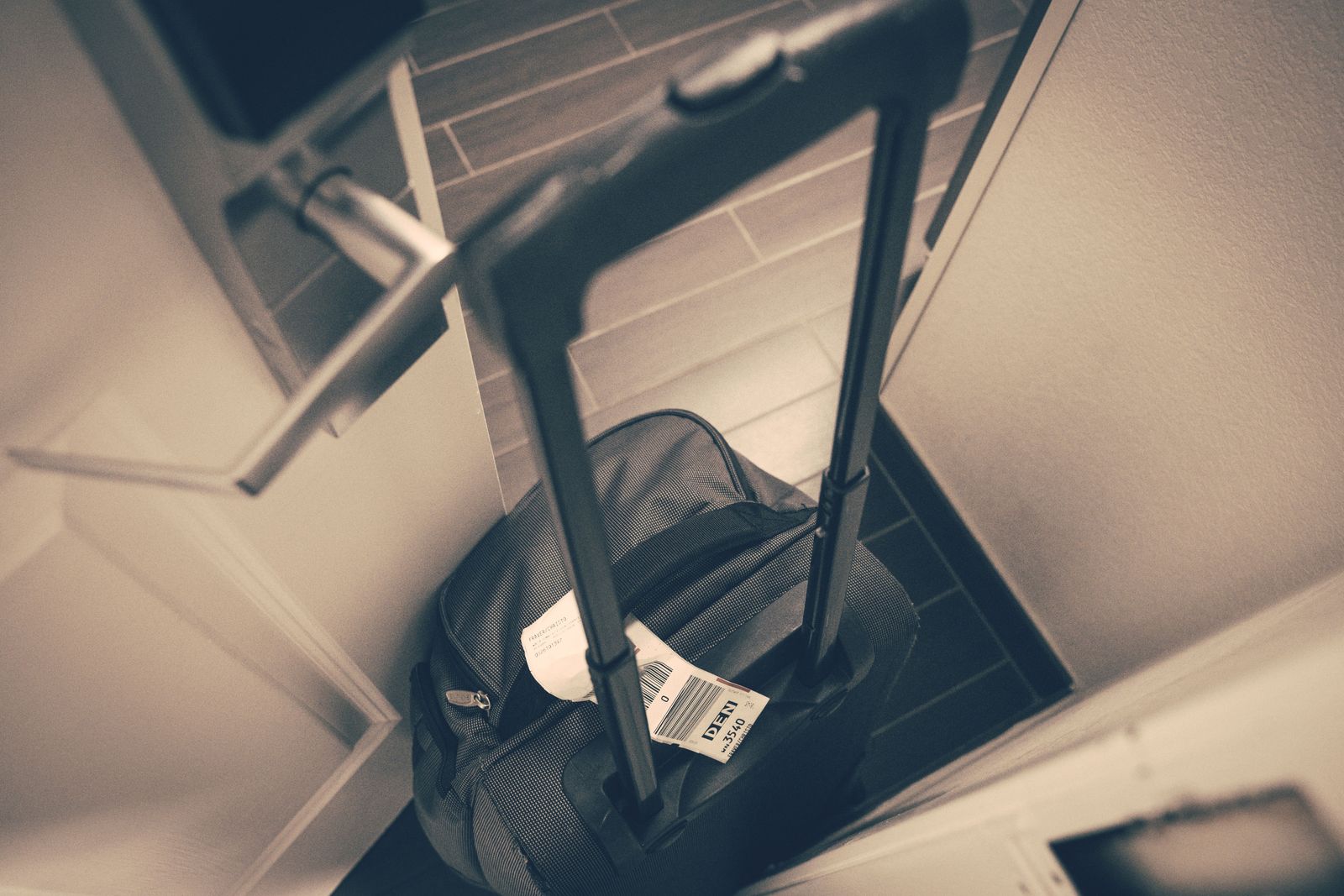 Luggage waiting by a guesthouse door for the morning transfer van on the Camino Português