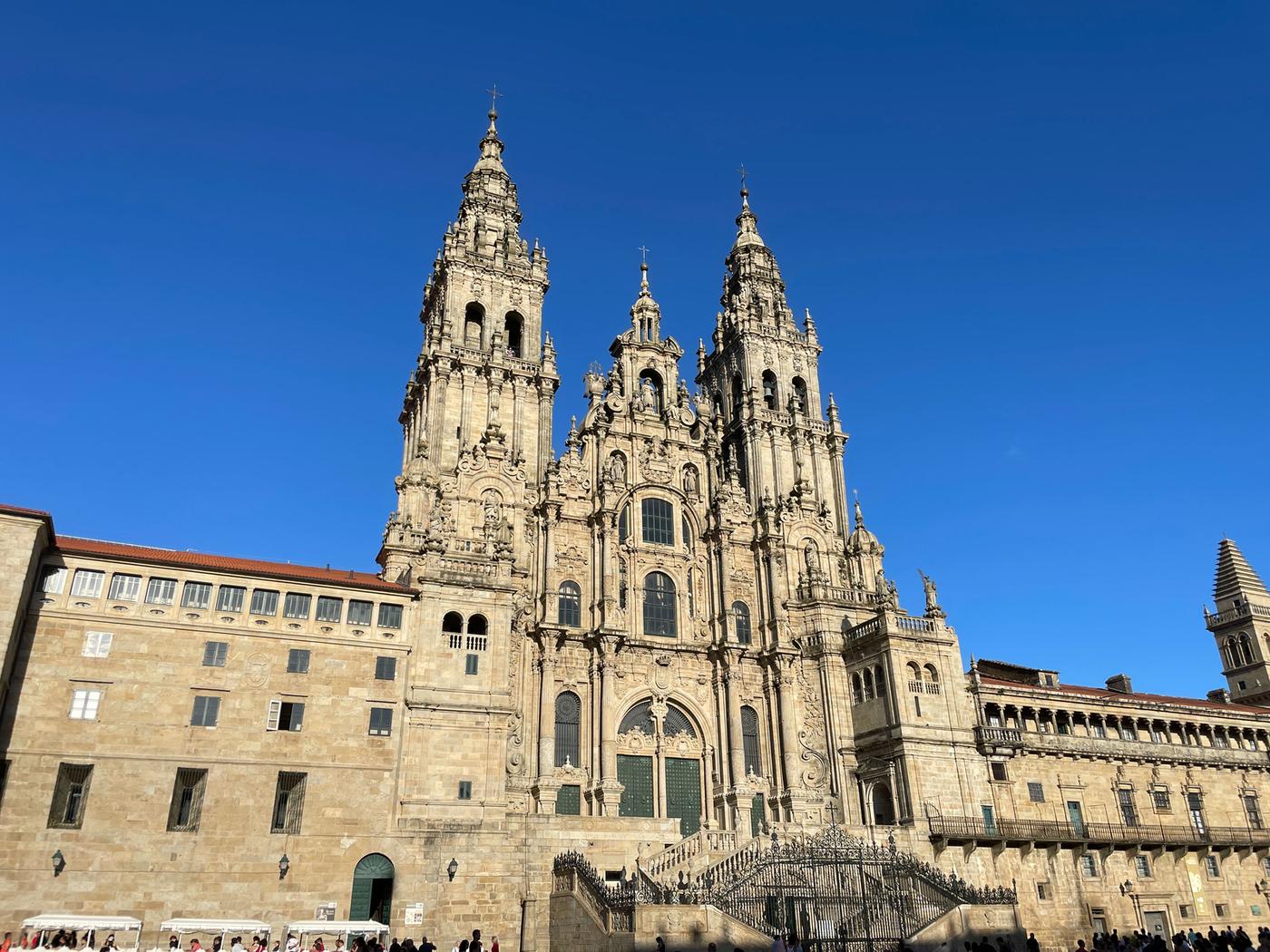 The spires of Santiago de Compostela Cathedral against a blue sky