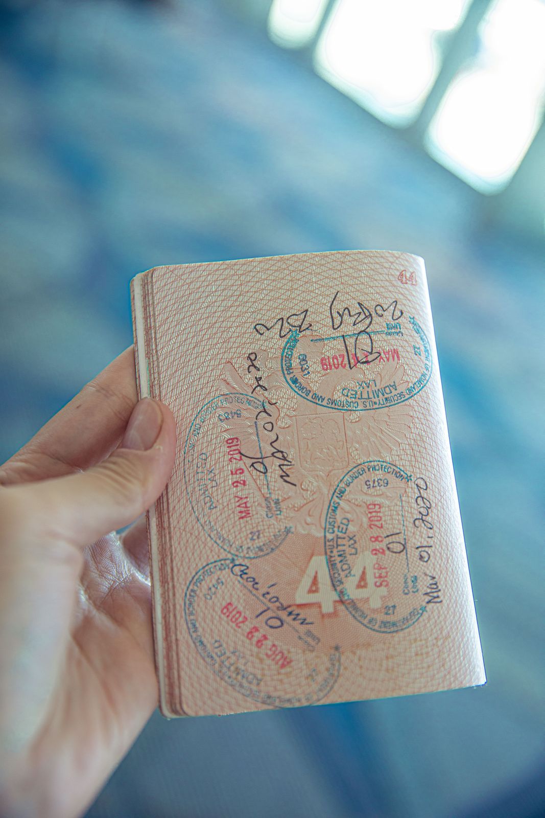 Open booklet pages covered in inked stamps, like the two stamps per day pilgrims collect in the credencial
