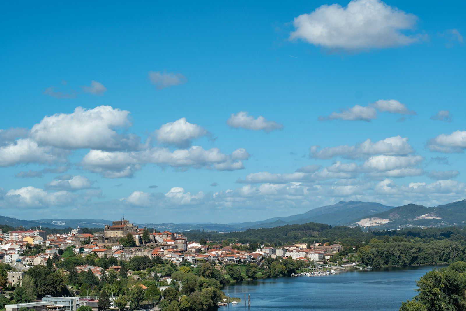 The Rio Mino flowing past the historic hillside old town of Tui, Galicia, where the last 100 km to Santiago begin